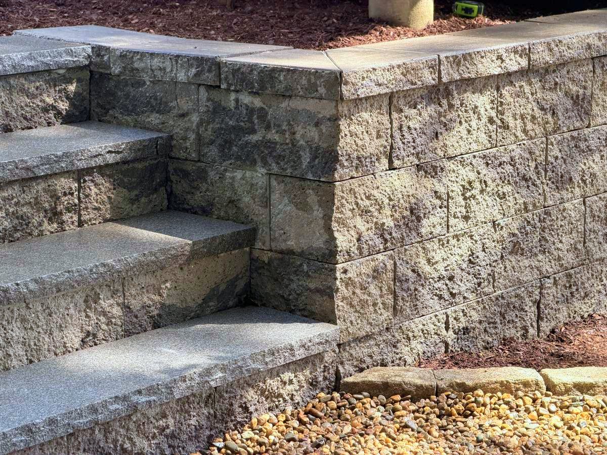 Close detail of a tread returning into the wall under the cap course