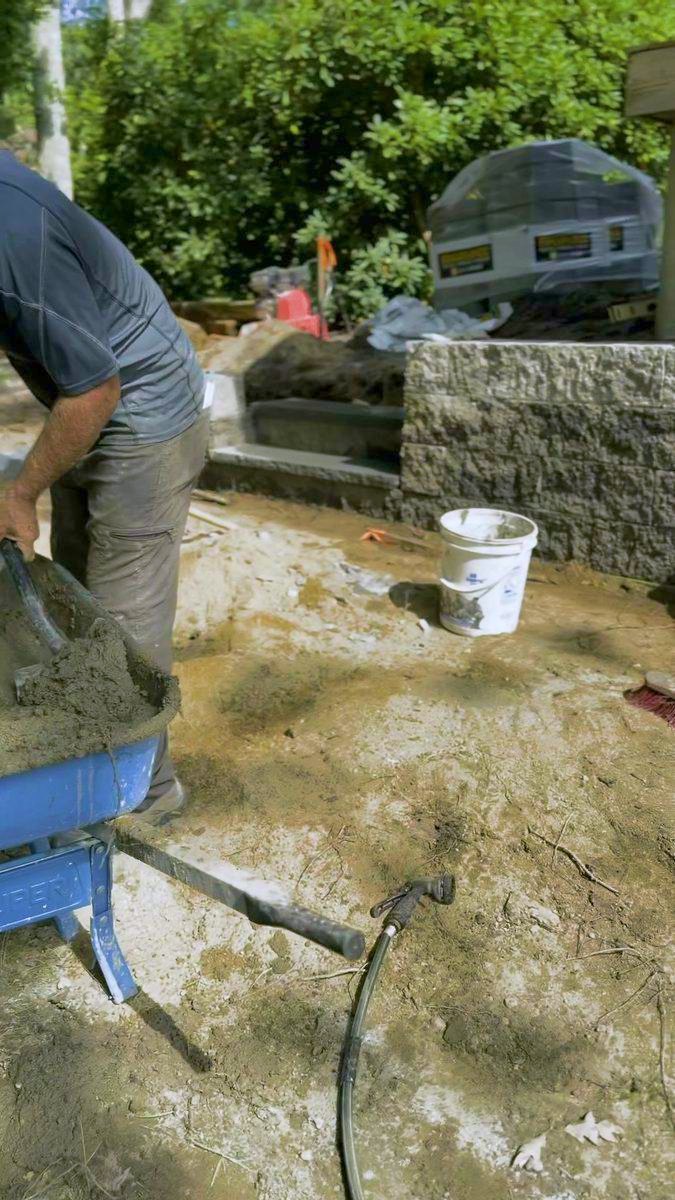 Mixing mortar alongside the finished course