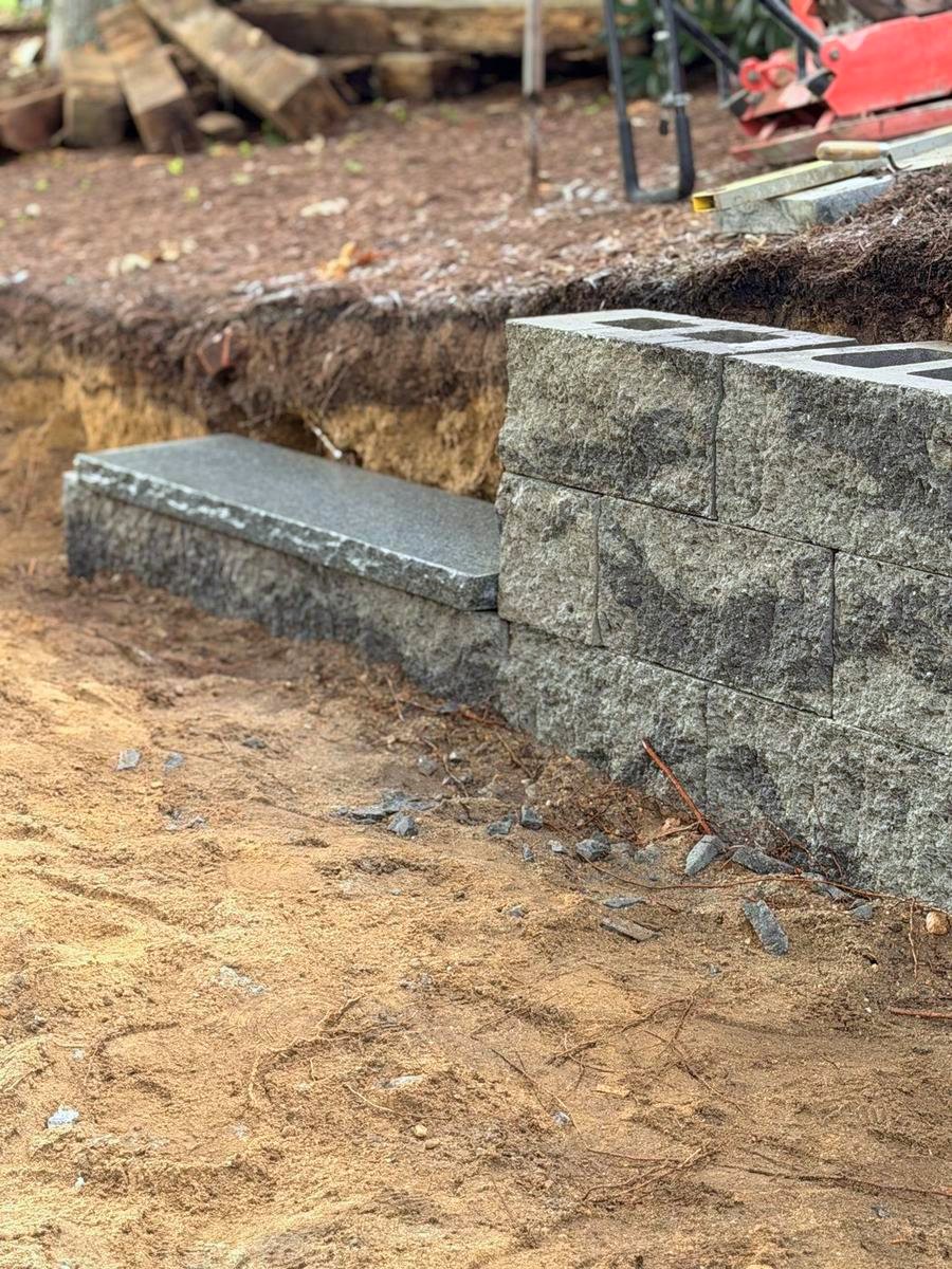 Granite tread set into the wall run
