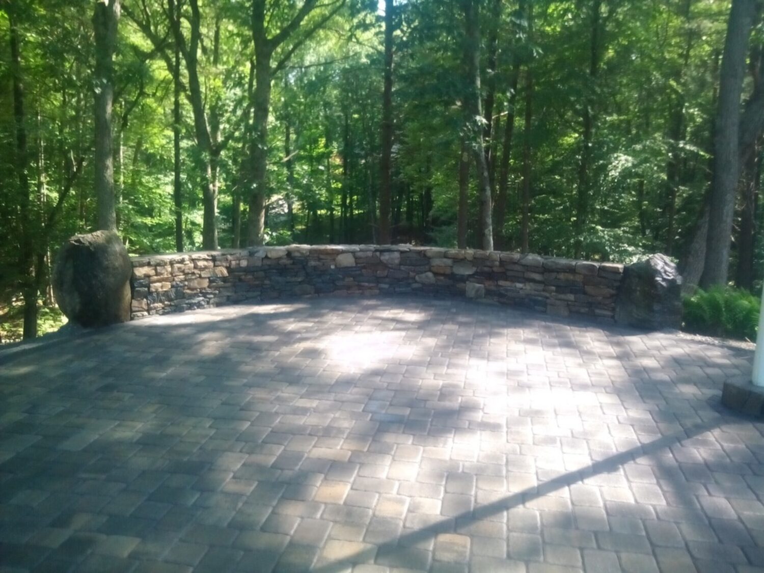 Fieldstone seat wall and paver patio